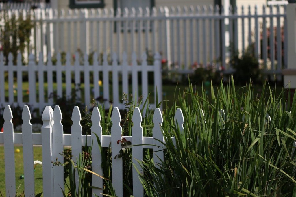 The cliche trope of a white picket fence